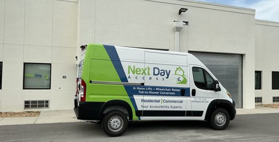 Next Day Access branded service van at a mobility-services location